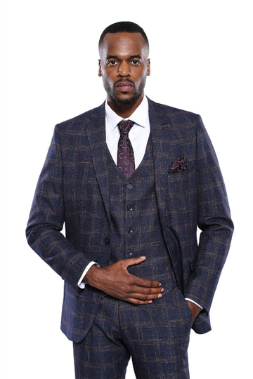 Man wearing a blue checkered suit with a white shirt and purple tie on a white background