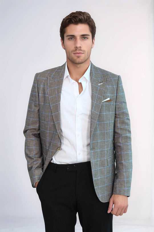 Man wearing a checkered blazer over a white shirt on a plain background