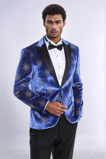 Man wearing a blue sequin tuxedo jacket with a white shirt and black bow tie on a white background