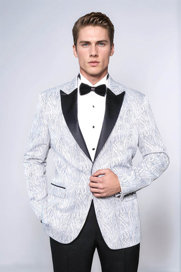 Man wearing a white patterned tuxedo with black lapels and bow tie on a light gray background