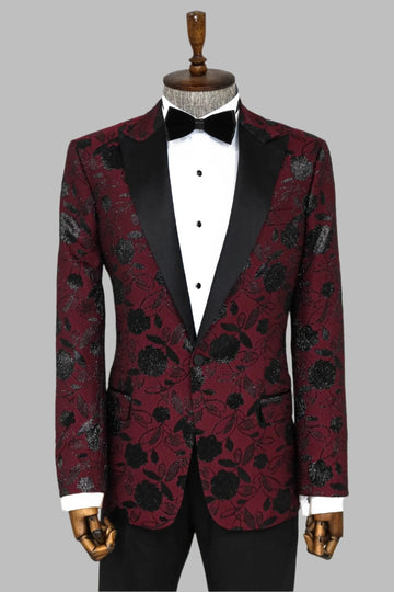 Red floral patterned tuxedo jacket with black lapels on a mannequin against a gray background