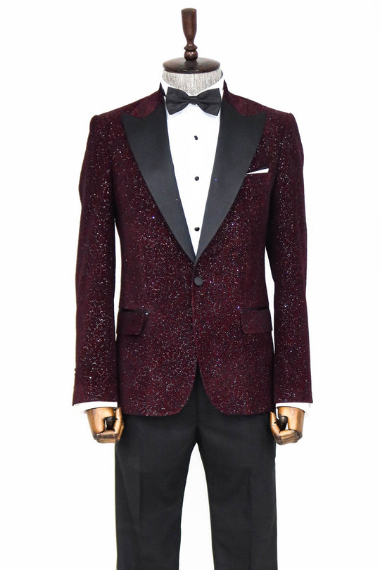 Burgundy tuxedo with black lapels on a mannequin against a white background