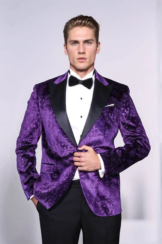 Man wearing a purple tuxedo with a white shirt and black bow tie on a light gray background