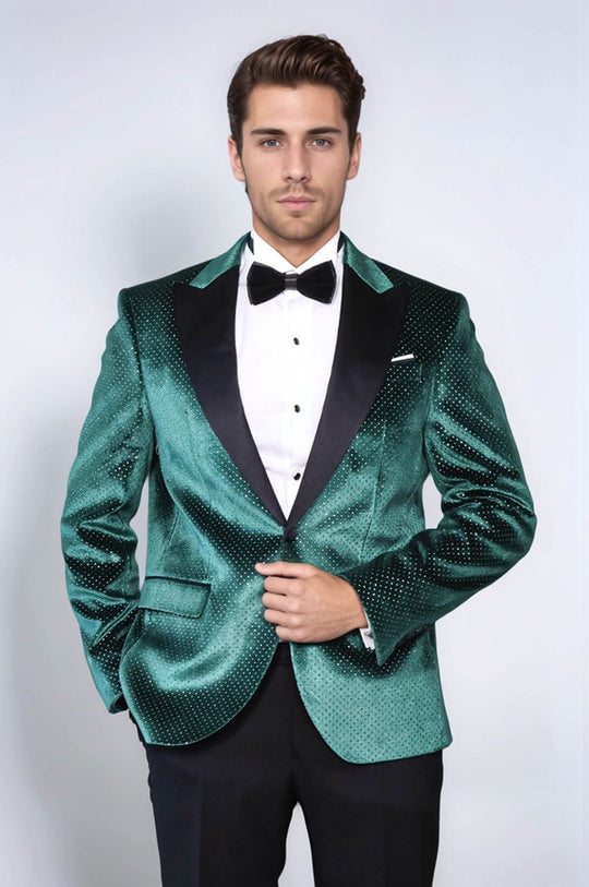 Man wearing a green tuxedo with a white shirt and black bow tie on a white background