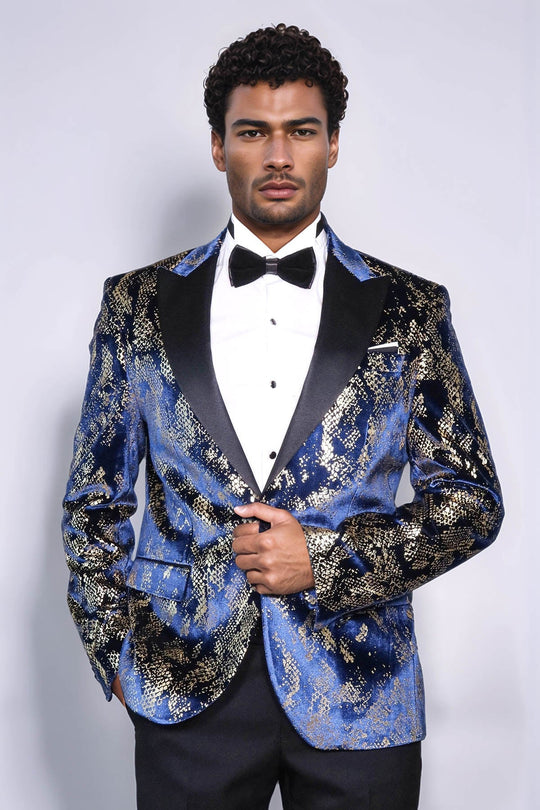 Man wearing a blue patterned tuxedo with a black bow tie on a white background