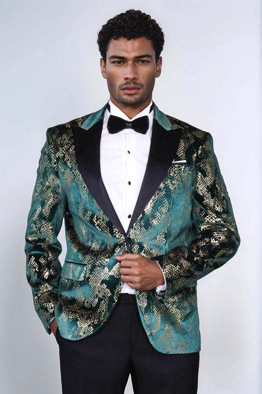 Man wearing a patterned tuxedo jacket with a white shirt and black bow tie on a white background