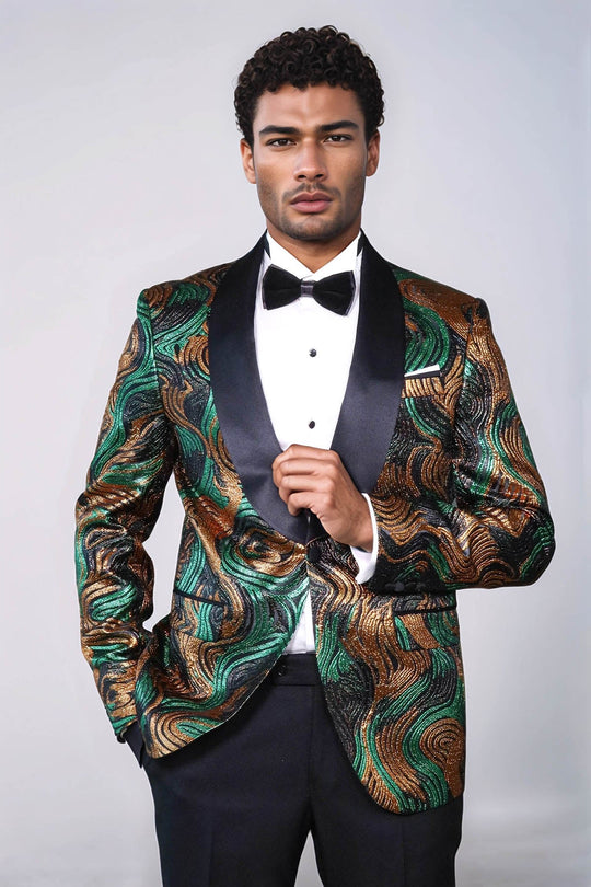 Man wearing a patterned dinner jacket with a bow tie on a white background