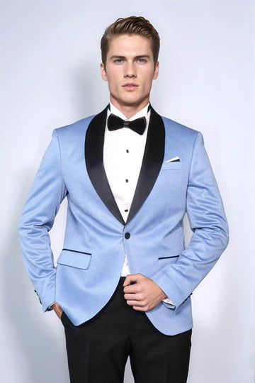 Man wearing a light blue tuxedo with black lapels and a bow tie on a white background