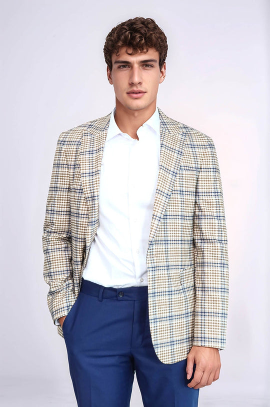 Man wearing a checkered blazer over a white shirt and blue pants on a white background