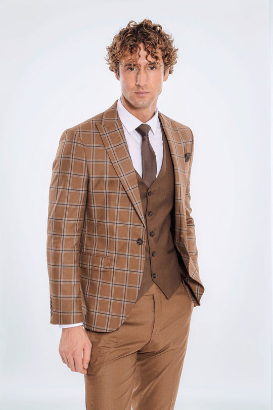 Man wearing a brown checkered suit with a tie on a white background