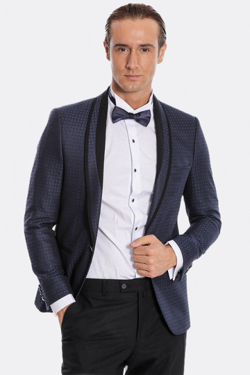 Man wearing a formal blue suit with a bow tie on a white background