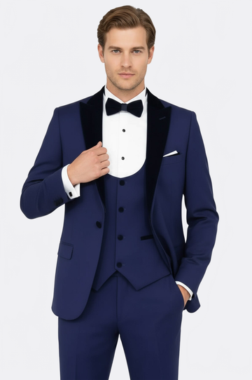 Man wearing a blue tuxedo with a bow tie on a white background
