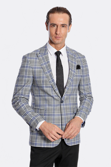 Man wearing a checkered blazer over a white shirt with a black tie on a white background