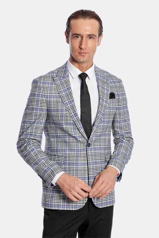 Man wearing a checkered blazer over a white shirt with a black tie on a white background