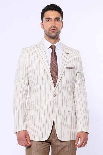 Man wearing a cream pinstripe suit with a white shirt and brown tie on a white background